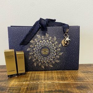Authentic Chanel Gift Box with Gold Amelia Charm,
Sublimge Serum and Pouch